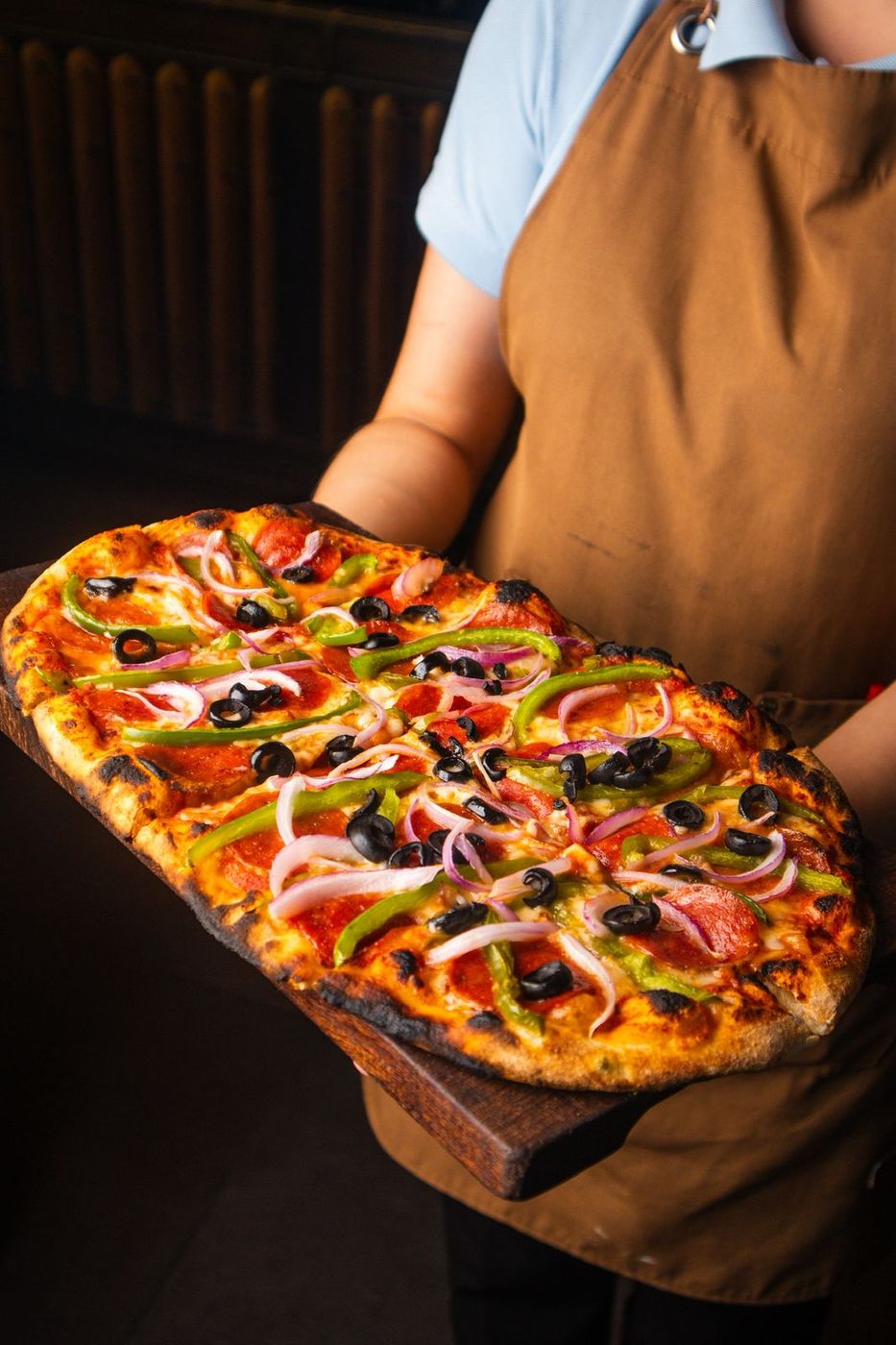 Pizza artesanal ovalada de Santo Olivo Express